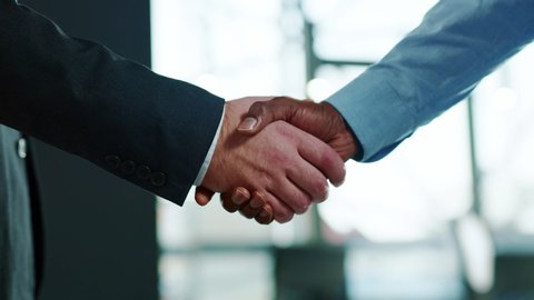 Close up hands business people shaking successful corporate partnership deal welcoming opportunity in office agreement professional greeting meeting colleagues partners slow motion