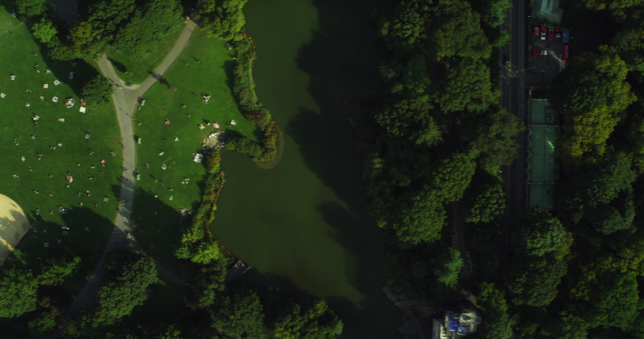 Aerial top down view of Central Park Manhattan in New York during the day under blue skies. Wide shot on 4K RED camera.