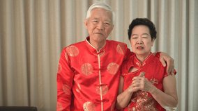 Asian senior couple celebrating Chinese New Year