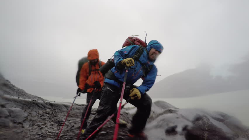 4k Adventure men fighting wind rain storm | Shutterstock HD Video #10439075