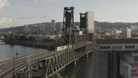 A beautiful rotating aerial view of Steel Bridge. Portland shot in 4K. Oregon. USA. The Steel Bridge opened in 1912.