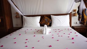 Interior design decor furnishing of luxury show home holiday villa bedroom with four poster bed. Interior design of the tropical villa on sea, island of Zanzibar, Tanzania, Africa, establishing shot - Powered by Shutterstock - Get 15% off with code: PIKWIZARD15