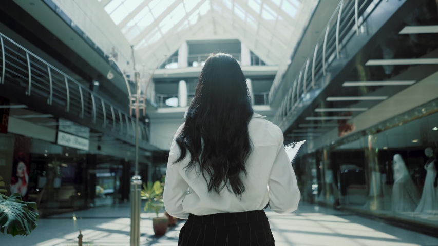 confident business woman walking in airport smiling independent female executive enjoying successful corporate career