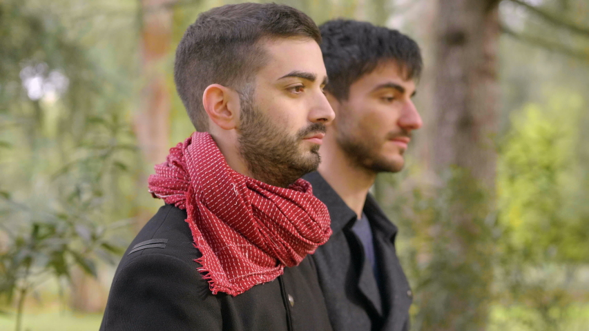 young attractive gay man conforting his boyfriend embracing him