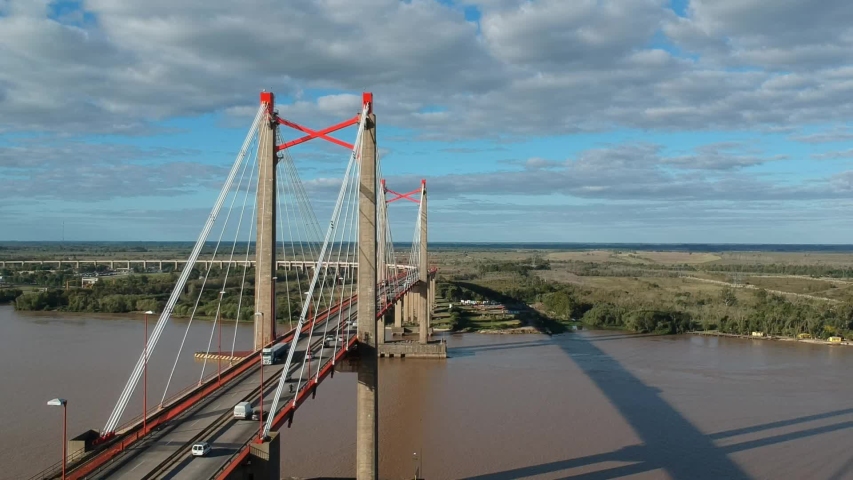 
Suspension bridge of the city of Zarate in Argentina from the air at sunse