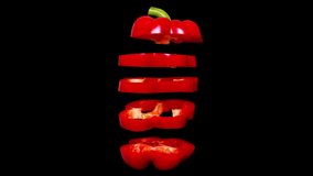 Creative concept with flying red paprika. Sliced floating pepper. Levity capsicum on black background - Powered by Shutterstock - Get 15% off with code: PIKWIZARD15