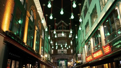 LONDON, circa 2019 - Slow motion POV night shot of the stunningly beautiful street lights of Carnaby Street in the Soho district of London, England, UK