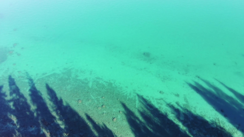 Drone at high altitude flying over the ocean with the view of a small island. Long Beach, CA