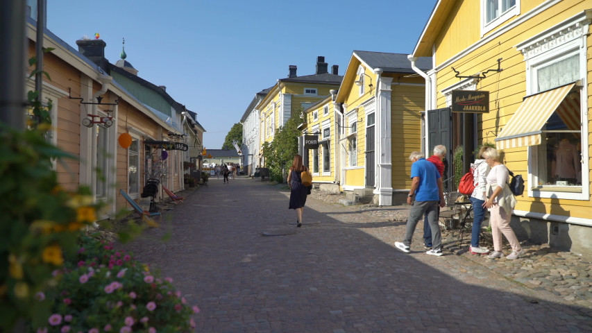 Porvoo, Finland - Sep 2, 2019: A lot of tourists walking past shops along the cobbled streets of the medieval old town section of Porvoo. One of the UNESCO world heritage sites in Finland