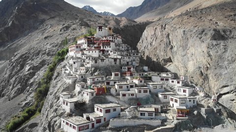 A beautiful aerial drone shot of Diskit Monastery, Nubra Valley, Ladakh. The Buddhist monastery is surrounded by a gorge on the eastern side.