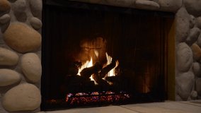 Fire burning bright and hot in stone fireplace hearth still shot - Powered by Shutterstock - Get 15% off with code: PIKWIZARD15