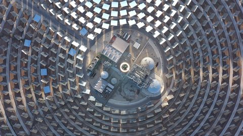 Abstract top aerial shot over a solar power tower Spain Gemasolar mirrors and sun reflections