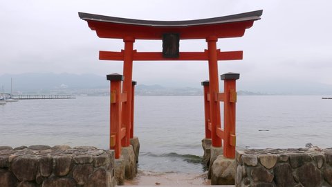 Tori gate in Japan in the sea shore bank, faceing the water