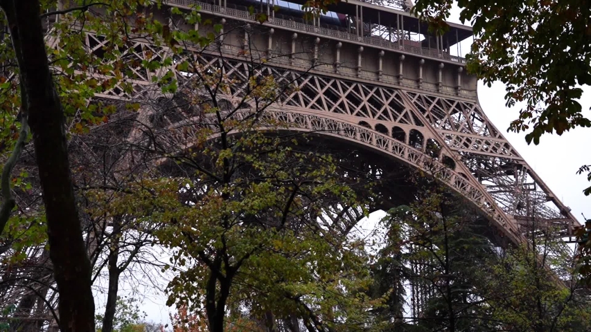 Tour Eiffel view from bottom throught the threes