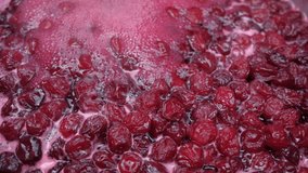 Making cherry jam, swarming or boiling cherry jam, slow motion video