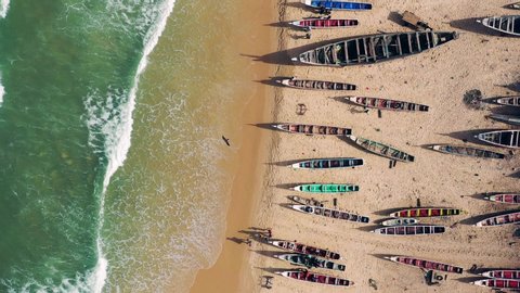 Aerial view of fishing village, pirogues fishing boats in Kayar, Senegal. Photo made by drone from above. Africa Landscapes.