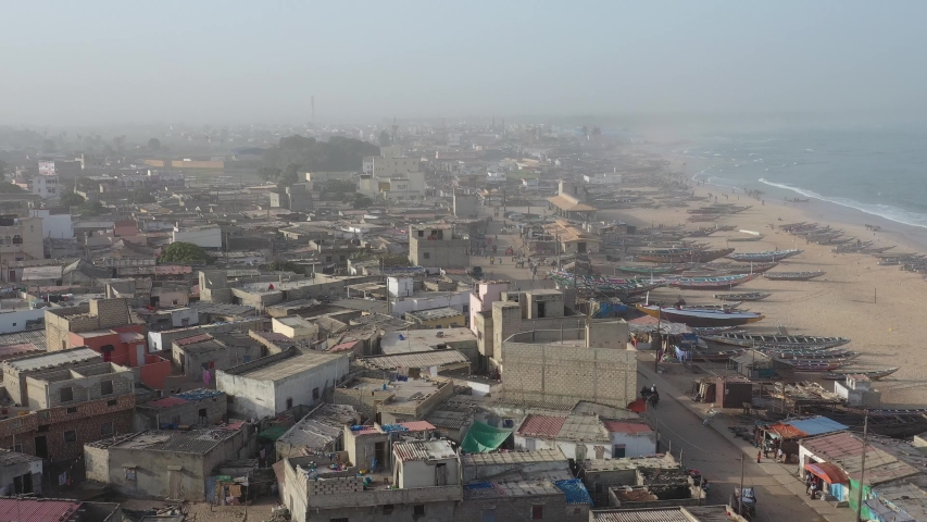 Aerial view of fishing village, pirogues fishing boats in Kayar, Senegal. Photo made by drone from above. Africa Landscapes.