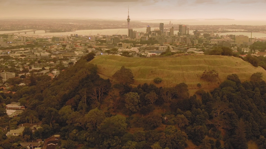 Aerial: Mt Eden and orange skies created from the Australian bush fires that swept accross the Tasman Sea. Auckland, New Zealand. 5 January 2019 