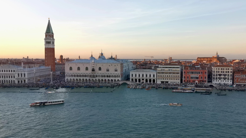 Departure from Venice by boat at sunset 