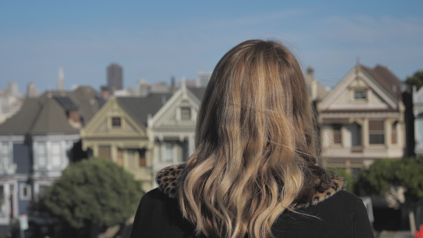 Attractive young millennial woman closeup Painted Ladies San Francisco