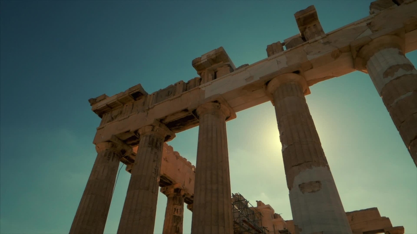 Sun shines between the columns of the Parthenon at the Acropolis in Athens, Greece Royalty-Free Stock Footage #1044050257