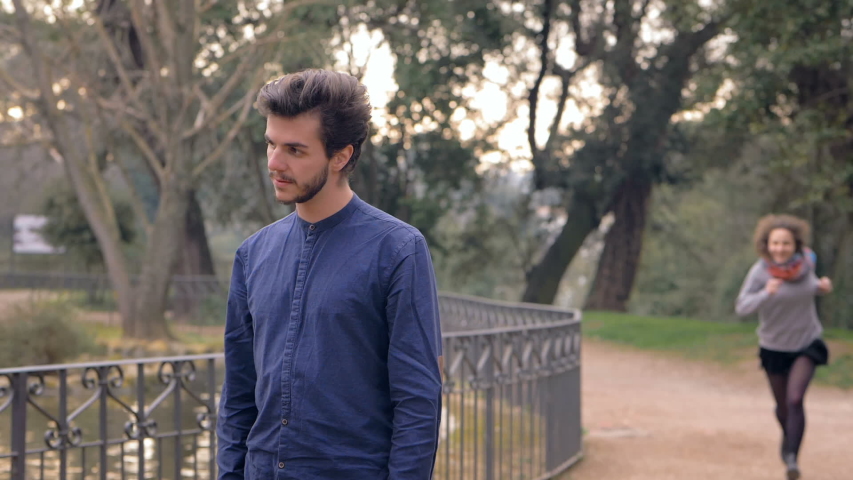 slow motion of happy couple at the park. The kissing passionalety