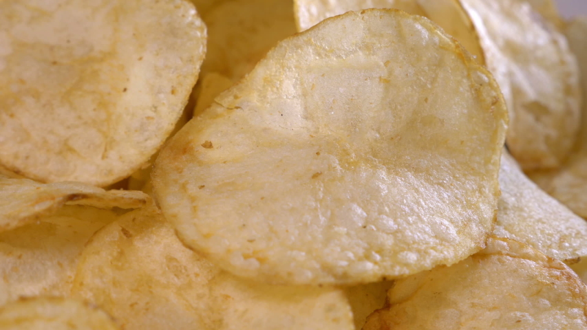 Golden potato chips close up	