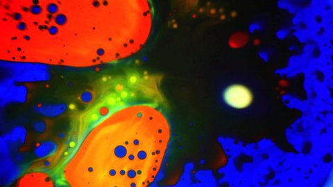 Abstract colorful paint reactions. Psychedelic liquid light show, dye patterns in water, oil, paint. Marble background for visual effects, motion graphics. Swirl pattern, ink explosion, kaleidoscope.