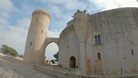 Bellver Castle, Palma de Mallorca, Balearic islands, Spain. Old medieval Gothic-style fortress built in the XIV century. Outside panoramic view of walls and donjon. 4K wide angle footage