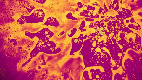Fantastic structure of golden bubbles. Scientific experiment, chemical reactions. Chaotic motion, bubble flow expansion, curlicue of paints. Psychedelic liquid light show, ink patterns in water + oil.