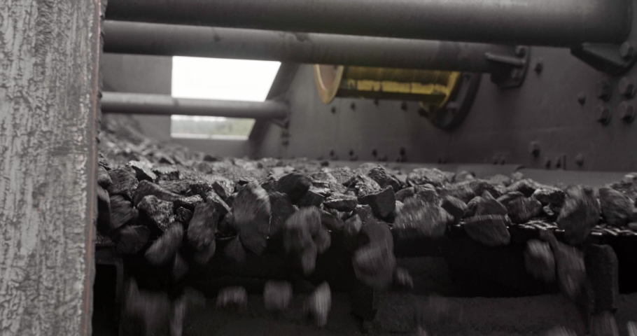 Conveyor belt with coal shooting in slow motion. Close-up there is coal on belt conveyor. Conveyor belt coal. Machine for loading mining in coal obage factory | Shutterstock HD Video #1044082825