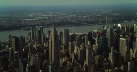 New York, NY, USA Circa 2018: Aerial view of Manhattan skyine Empire State Building in New York during the day under blue skies. Wide shot on 4K RED camera.