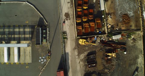 Aerial view of shipyards with cargo ships near Hudson river in New York during the day time. Wide shot on 4K RED camera.
