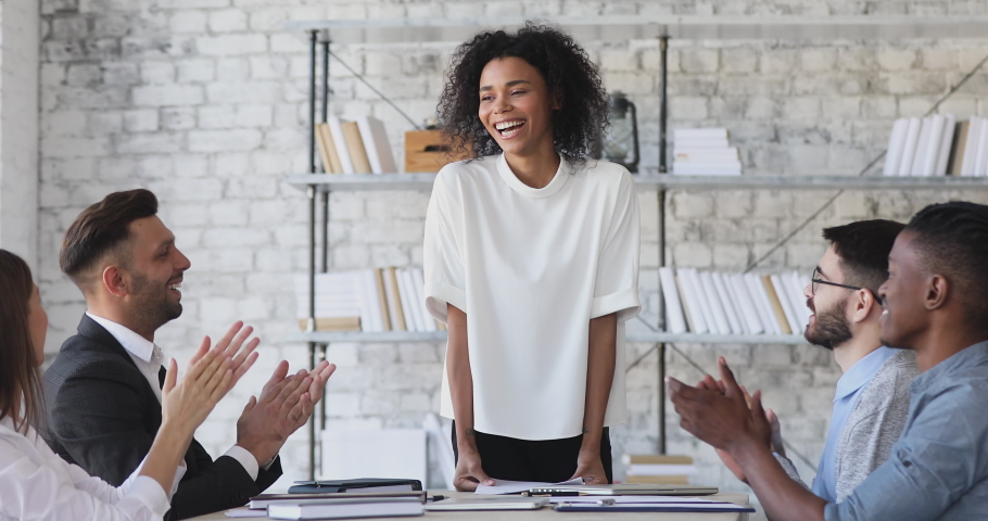 Happy pleased female african american boss get team applause after financial report presentation at group meeting, multiethnic employees team clapping hands thanking mentor at conference room table Royalty-Free Stock Footage #1044100660