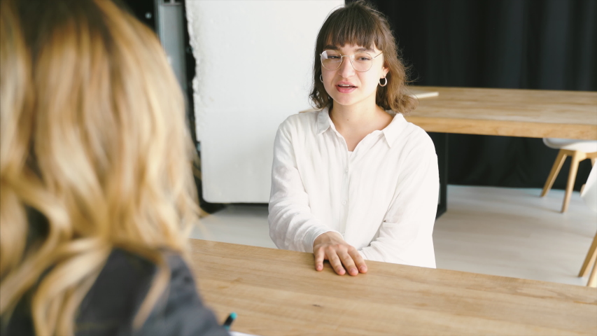 Young female candidate interviewed by employer