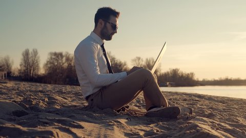 Businessman With Laptop On Beach. Freelancer Internet Online Meeting Webinar. Man Freelance With Computer Outdoors. Study Online Work Typing Email. Businessman. Remote Working In Internet Distance Job