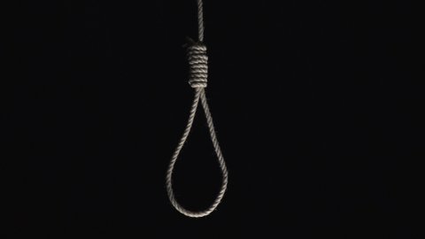 Rope noose hanging down on a Black background. Topics: Suicide, Mental Health, Depression