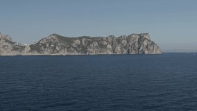 Aerial Drone footage view of Faraglioni Rocks in Sea in Capri Naples Costiera Amalfitana Italy Europe // no video editing