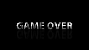 The word "Game Over" on a dark background is assembled from many cubes and then dissolved. Text on a reflective surface. loop animation 4k - Powered by Shutterstock - Get 15% off with code: PIKWIZARD15