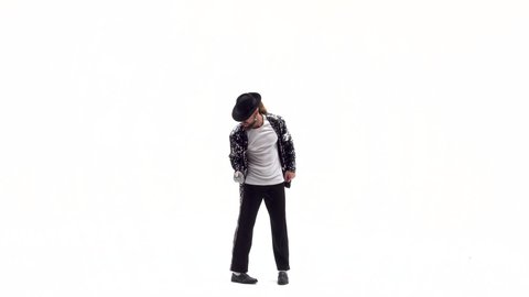 Young stylish teenager is showing dance moves like Michael Jackson. Isolated over white background.