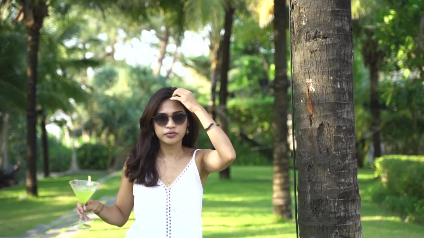 asian pretty girl with lemon cocktail are  Walk forward 