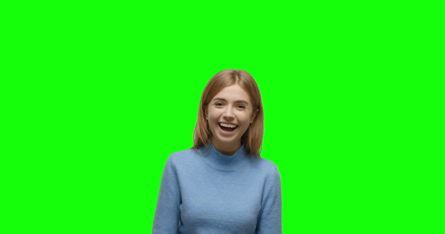 Young cheerful caucasian woman showing thumbs up over green screen background Chroma Key. 4k video footage slow motion 60 fps Royalty-Free Stock Footage #1044183508