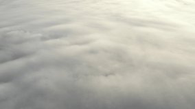 Low clouds over the land viewed from above 4K aerial video