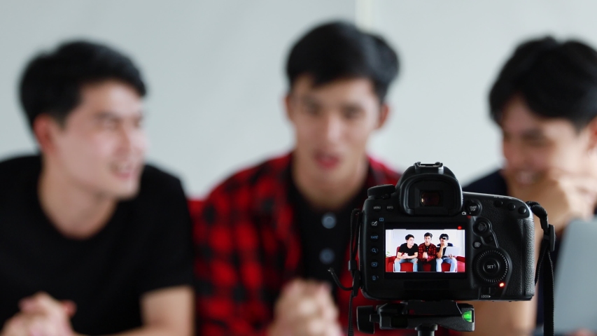 Group of three handsome Asian influencers on-air their live video to their channel for reached to their followers.
 | Shutterstock HD Video #1044188386