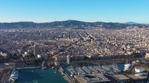 Sunset over Barcelona Gothic Quarter aerial harbour and mountains Spain 