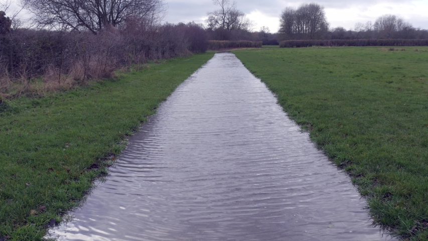 A pathway flooded after heavy rainfall