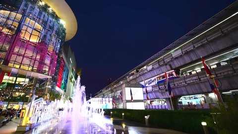 Bangkok, Thialand - January 1,2020:Peoples visit Siam Paragon, is one of the most popular shopping malls is famous with color of light of fountain outdoor and Biggest Shopping Center in Thailand