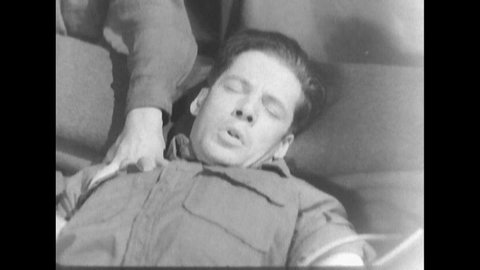 CIRCA 1940s, soldier suffering from PTSD is injected with medication to induce a therapy session