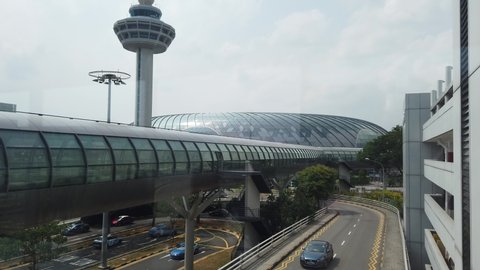 Singapore - Aug 8, 2019: view of Jewel glassed Dome and Control Tower of new Changi International Airport of Singapore opened in April 2019.