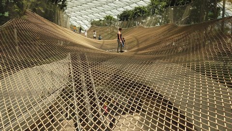 Singapore - Aug 8, 2019: Manulife Sky Nets Bouncing the most fun attraction in Canopy Park in Jewel Changi Airport, a nature-themed with gardens, attractions, retail and restaurants, opened in 2019.